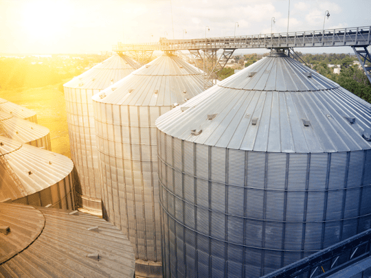 Grain storage silos. Galvanized tanks for grain. Granary with mechanical equipment for receiving, cleaning, drying, grain shipment